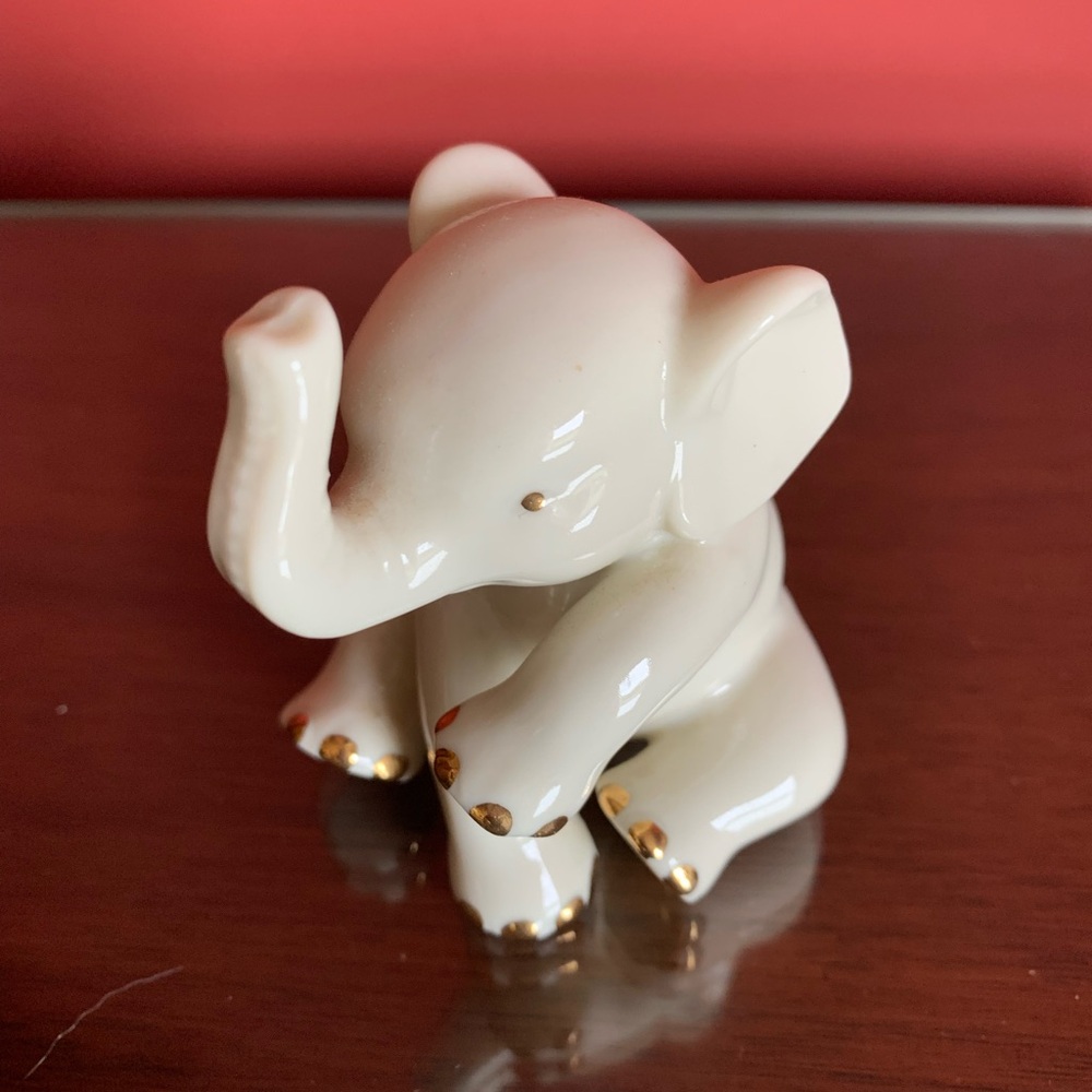 Cream Ceramic Elephant Figurine with Gold Accents $15